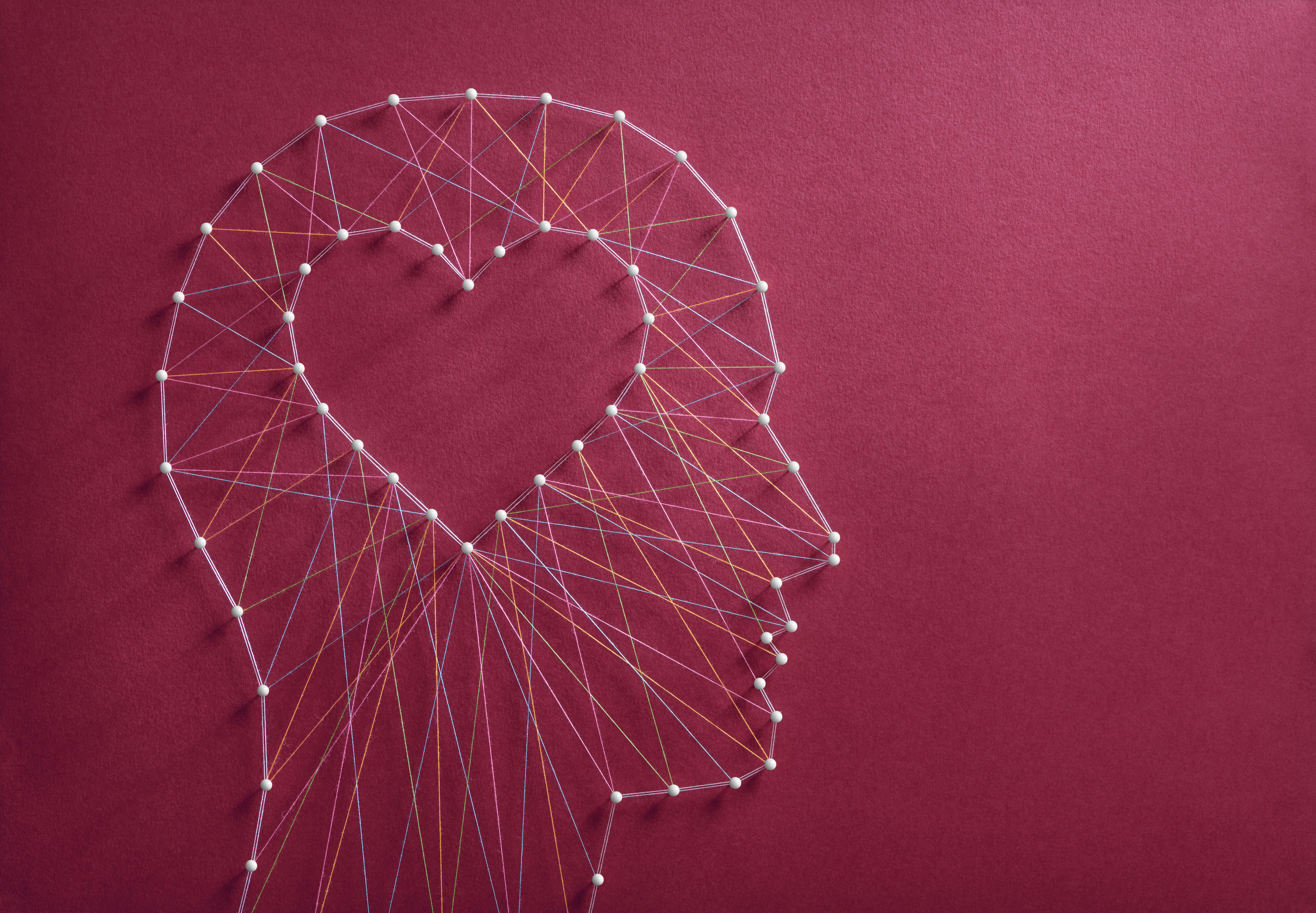 Side profile outline of a head with heart inside